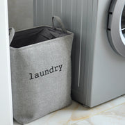Grey Mesh Linen Rectangular Fabric Laundry Basket Beside Washing Machine