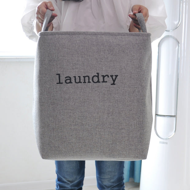Holding a Grey Mesh Linen Rectangular Fabric Laundry Basket