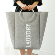 Holding a Hessian Fabric Grey Laundry Basket with Handle 