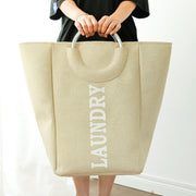 Holding a Hessian Fabric Cream Laundry Basket with Handle
